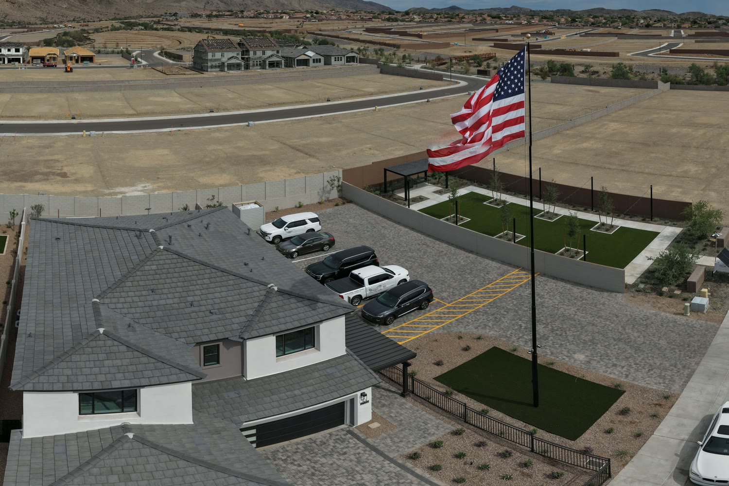 Drone view of finished model homes at Upper Canyon, with new homes going up behind them
