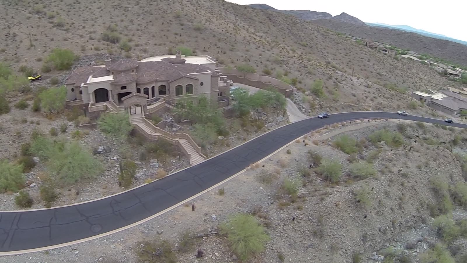 A hillside home above a road climbing through the Ahwatukee foothills