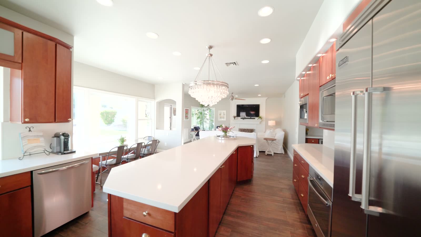 A kitchen with an island and built-in appliances