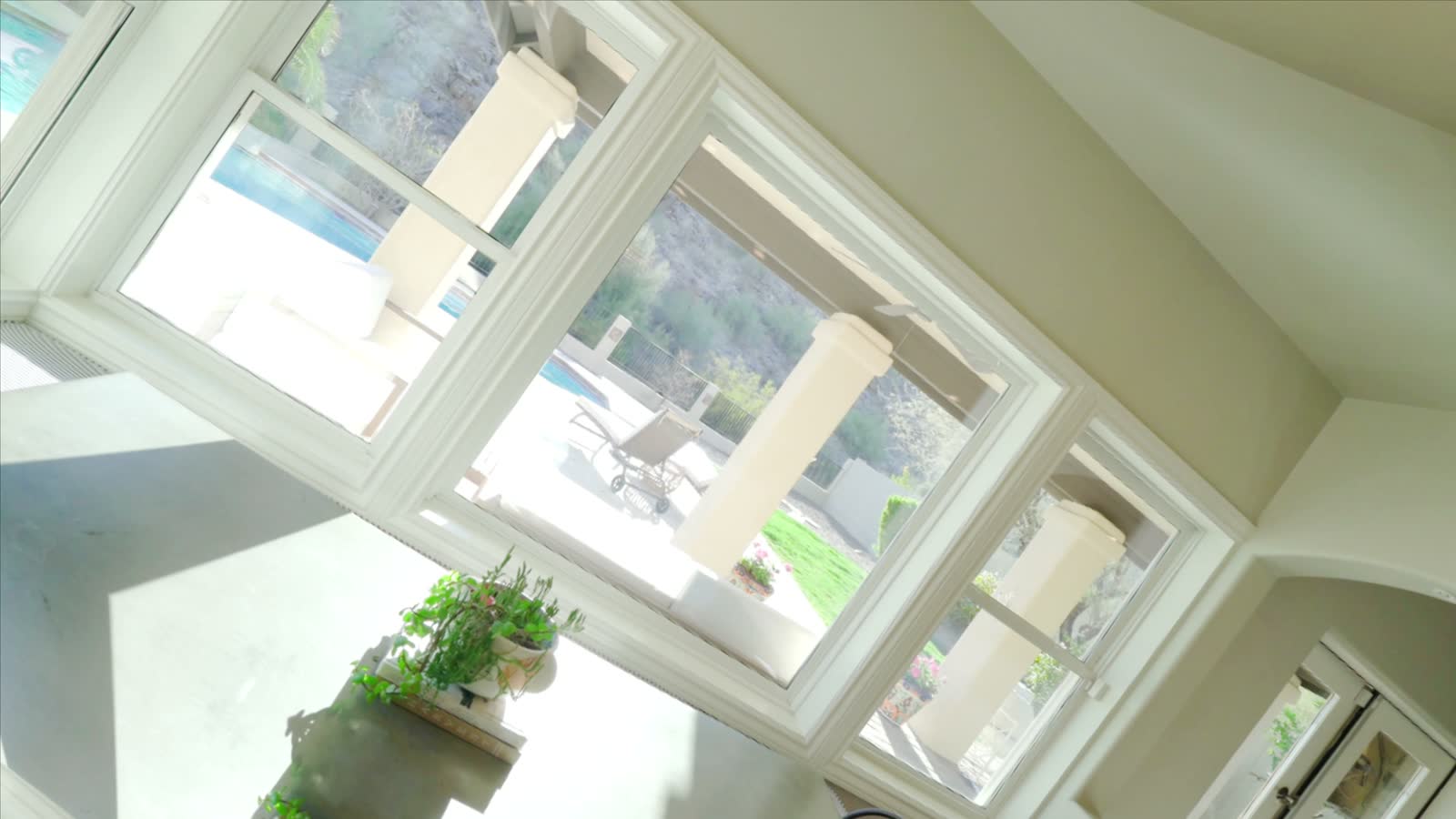 A wall of windows looking onto a garden