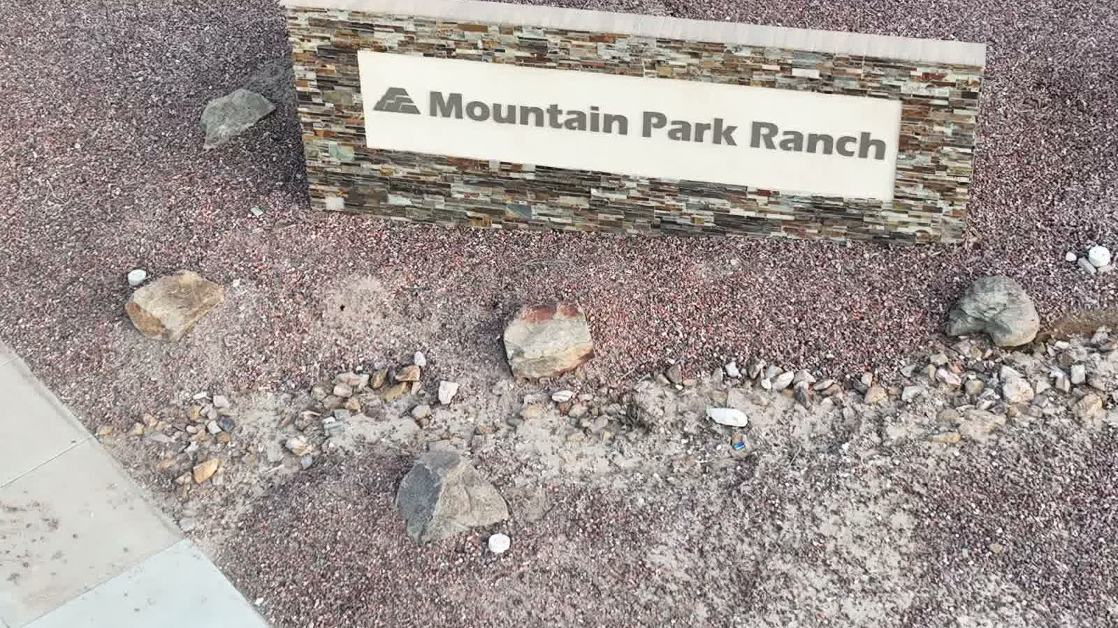 The Mountain Park Ranch entrance monument beside the road, seen from the air