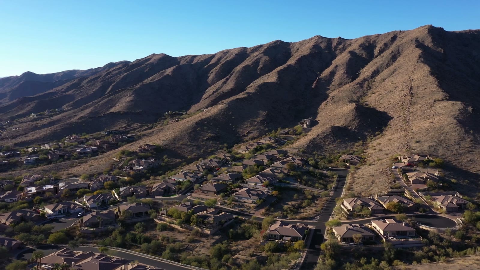 The South Mountain ridge rising directly behind Ahwatukee homes