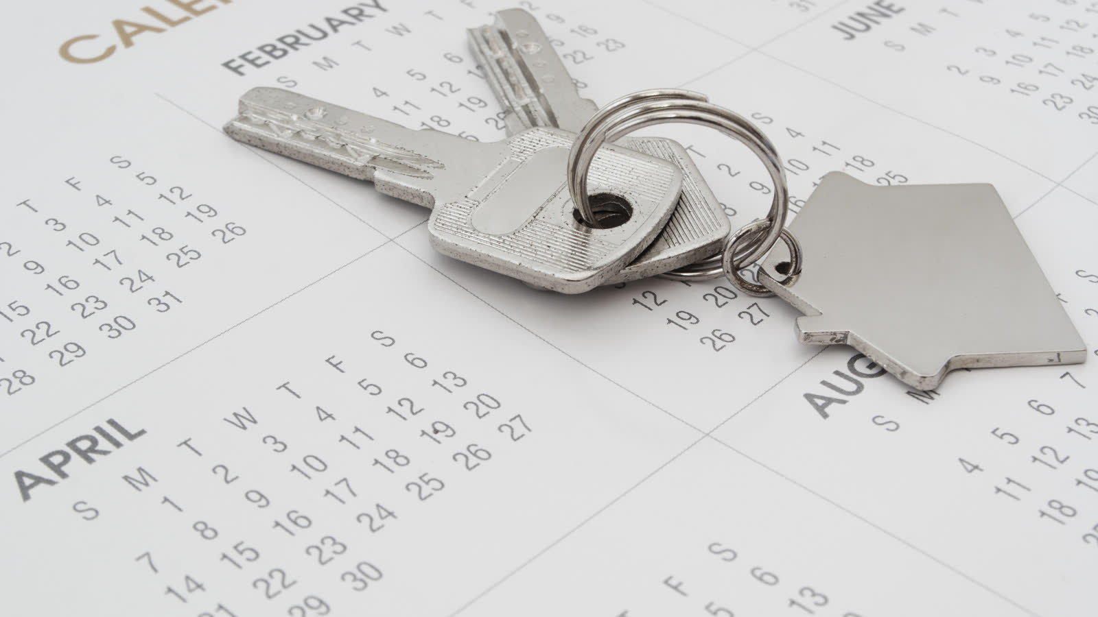 House keys resting on a calendar
