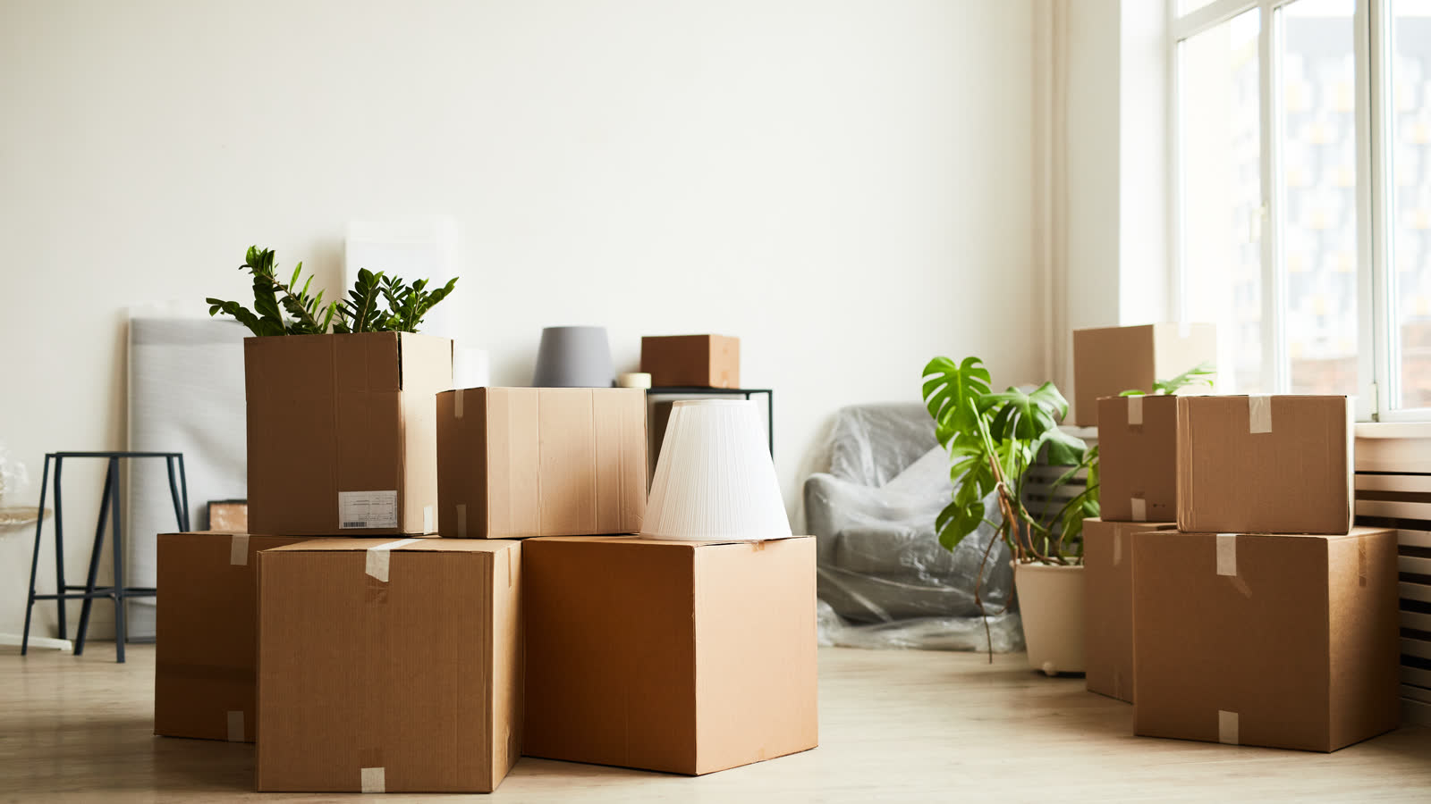 Cardboard packing boxes stacked in an empty room