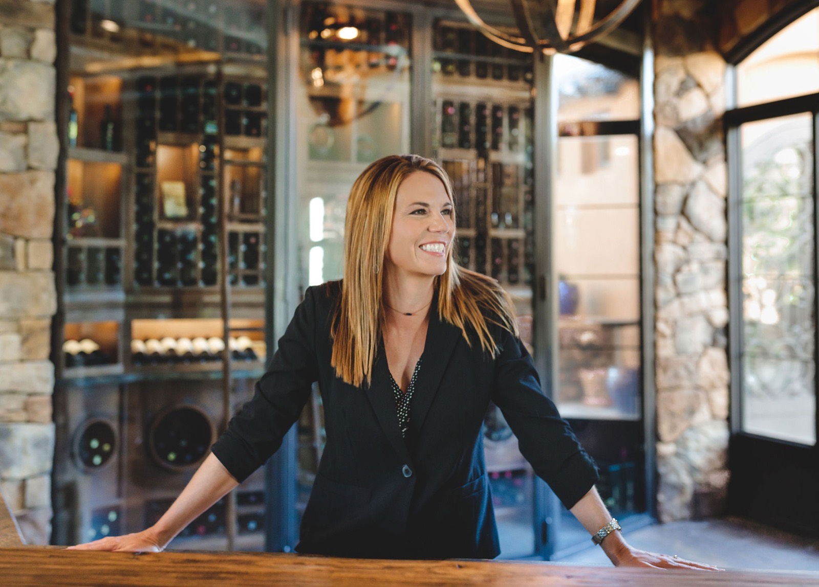 Amy Richardson smiling, leaning on a kitchen counter