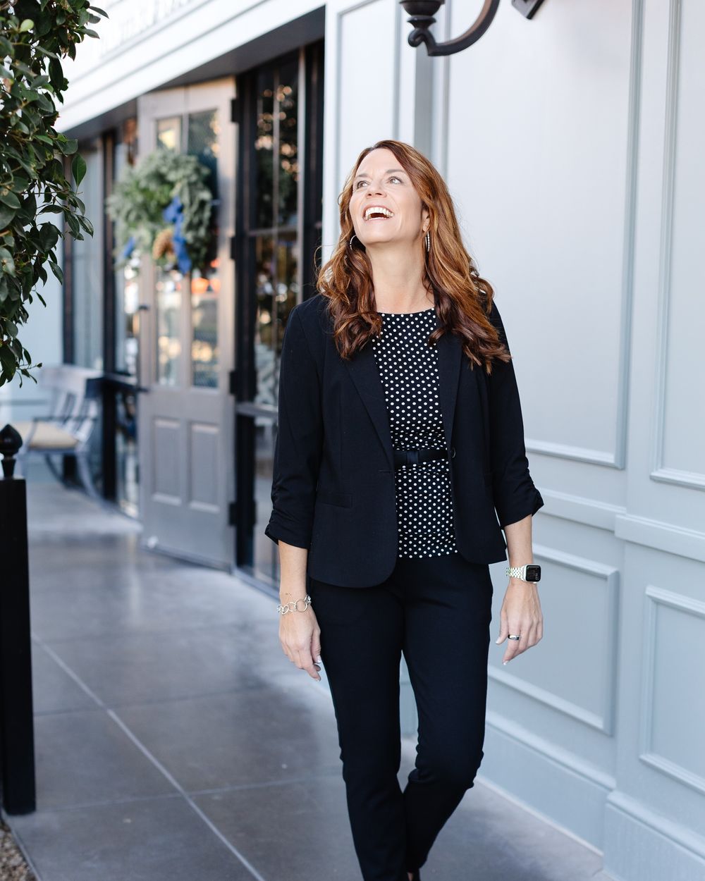 Amy Richardson laughing as she walks along a sidewalk